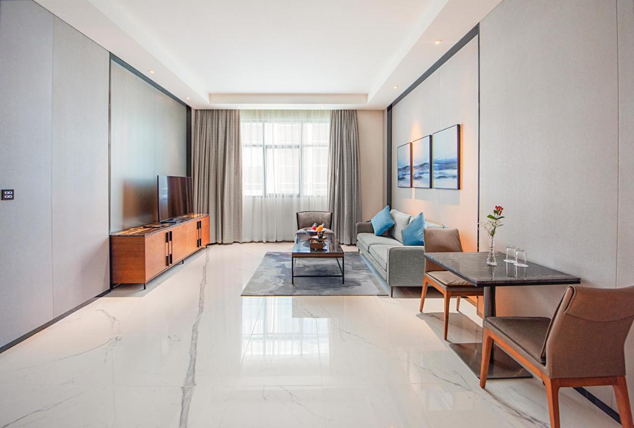 Asiana Grand Hotel Dubaï Extérieur photo A living room in a serviced apartment in Beijing, China